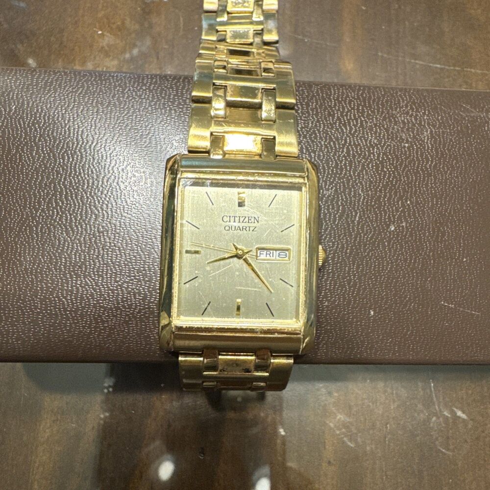Citizen Quartz Mens Gold Tone Rectangular Day Date tank Watch 1002-S99299 HSB
